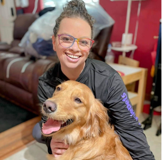 Carla McClellan greets Sadie the Super Pup